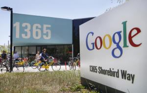 Google employees ride their Google multi-colored bicycles to and from the GooglePlex along Shorebird Way in Mountain View, Tuesday, June 24, 2014. Large