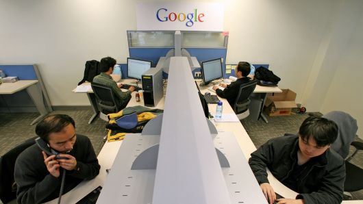 Google engineers work in the company's office.